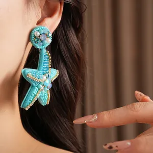 Exquisite beaded blue starfish earrings with luxury design and intricate hand-woven details