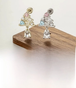 Detailed view of coffee gold Christmas tree cartilage stud with zircon water drop charms