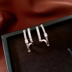 Luxury rose gold C-shaped double hoop earrings with cubic zirconia in a velvet box