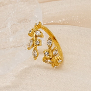 Macro shot of 18K gold plated leaf ring featuring marquise-cut clear zircon stones