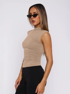 Slim fit high neck sleeveless beige top with ruched waist detail and stretch fabric