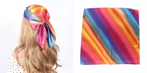 Detailed view of a rainbow striped satin scarf worn as a headband and laid out flat