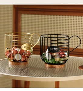 Detail of metal wire coffee pod basket with wooden base and decorative COFFEE label