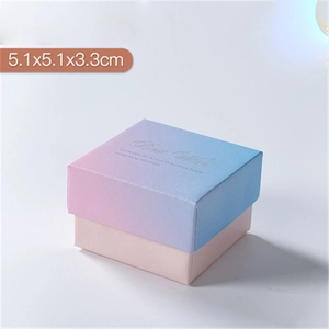 Macro detail of a 5.1x5.1x3.3cm pink and blue gradient jewelry box with Best Wish text