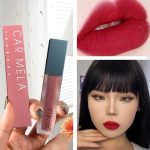 Matte velvet lip mud in retro red with frosted tube and asian model makeup look