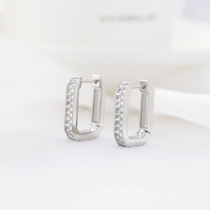 Minimalist silver rectangular hoop earrings with paved cubic zirconia in a modern style