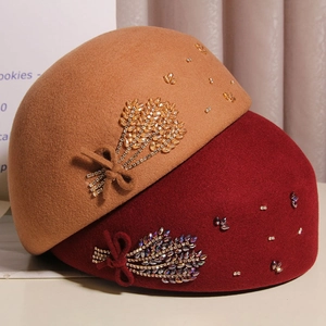 Detail of wool beret with crystal wheat ear embroidery and elegant ribbon bow detail