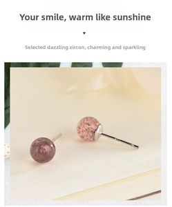 Close-up of pink strawberry crystal stud earrings with S925 sterling silver needles