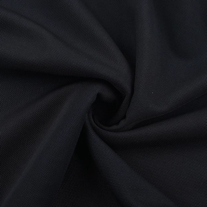 Close-up of black breathable mesh fabric showing fine texture and soft draping effect