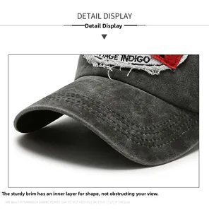 Detail shot of vintage washed charcoal baseball cap with sturdy brim and embroidery