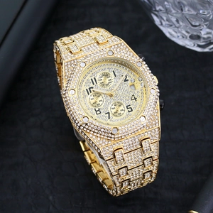 Detailed macro shot of luxury gold iced-out watch with three sub-dials and crystal pavé