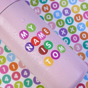 Waterproof round letter stickers for personalized DIY decoration on a purple water bottle