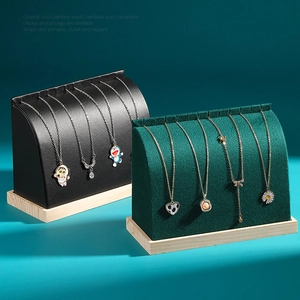 Curved necklace display stand with solid wood base and leather velvet finish