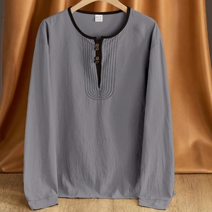 Men's retro dark grey linen Henley shirt with long sleeves hanging on a wooden hanger