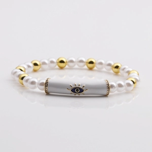 Elegant pearl and gold bead bracelet with a central blue evil eye enamel tube charm