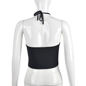 Back view of a black halter crop top with tie-neck straps and a minimalist design