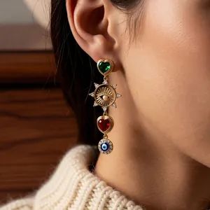 Vintage asymmetric tassel earrings with colorful heart gems and evil eye pendant in gold