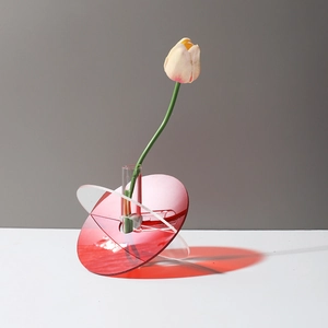 Artistic acrylic vase with red and transparent geometric discs and central test tube