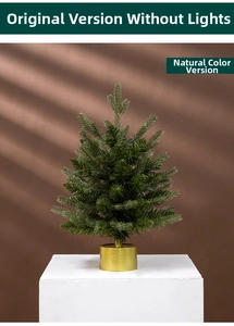 Miniature flocked Christmas tree with a golden rotating music box base and green needles