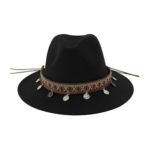 Detailed view of black ethnic wool fedora hat with patterned band and silver coins