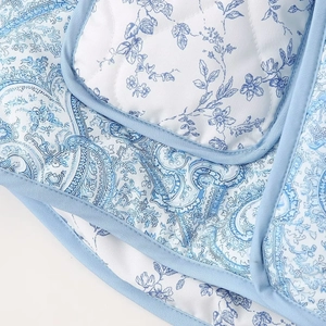 Quilted floral cotton jacket with blue paisley pattern and turn-down collar