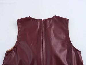 Back view of burgundy faux leather tank top with hidden zipper closure and sleek PU finish
