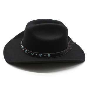 Detail of black felt cowboy hat with ethnic band and turquoise stone embellishments