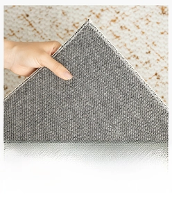 Detail of non-slip cotton-linen rug backing showing breathable and wear-resistant texture