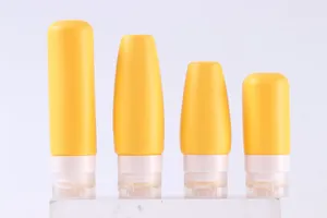 Detail of yellow silicone travel bottles in 100ml and 60ml sizes with flip caps