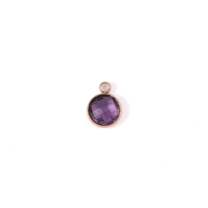 Detailed view of a 7mm round faceted purple birthstone pendant in rose gold setting