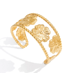 18K gold-plated stainless steel wide cuff bracelet featuring three cutout floral designs