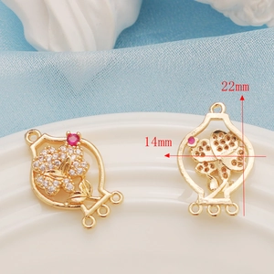Macro detail of 14K gold-plated flower pendant with dimensions 14mm by 22mm