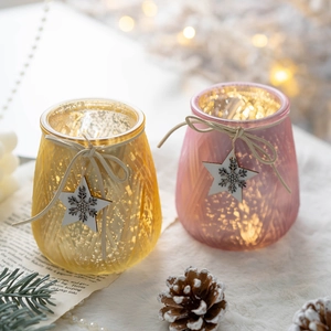 Golden and pink glass Christmas candle holders with wooden snowflake charms and LED lights