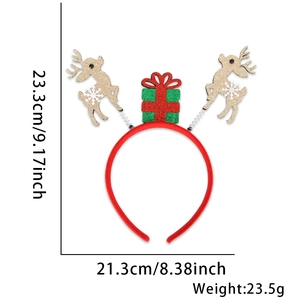 Detailed view of a Christmas headband with glitter reindeer and gift box decorations