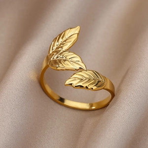 Detail of 18k gold plated stainless steel ring with elegant carved leaf texture