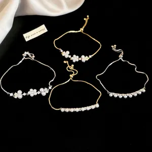 Luxurious French style floral pearl bracelets with sparkling zircons on black velvet