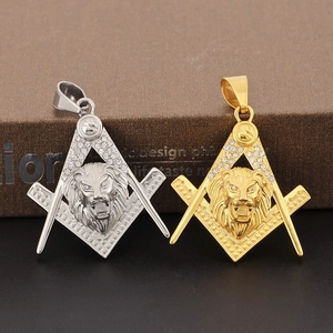 Detailed close-up of gold and silver lion head pendants with Masonic symbols and rhinestones