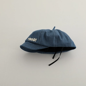 Navy denim newsboy cap for boys with Hello embroidery and adjustable tie detail