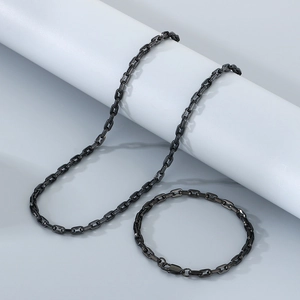 Detail of black stainless steel hip-hop necklace and bracelet set with pig nose link chain