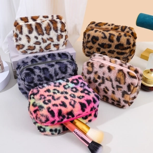 Detailed collection of plush leopard print makeup bags in various colors and soft faux fur