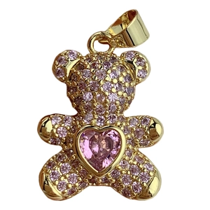 Charming 18K gold teddy bear pendant featuring pink pavé crystals and a heart stone