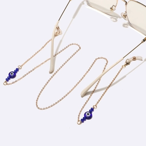 Golden eyewear chain with blue crystal evil eye beads and lobster clasps for women