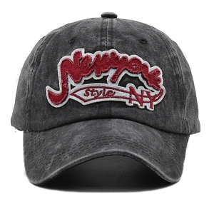 Detailed macro view of 3D embroidered New York patches on washed canvas baseball cap