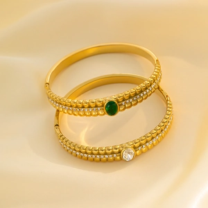 Vintage gold-plated stainless steel bangles with green zircon and hollow patterns