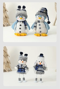 Close-up of Mediterranean blue plush Christmas penguins and snowmen figurines with knit hats
