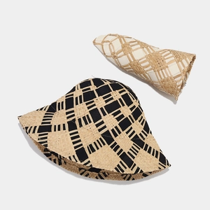 Cross woven straw sun hat for women in black and beige, perfect for beach vacation styling