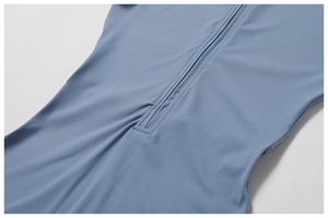 Detail of invisible zipper on blue nude-feel yoga bodysuit with high-quality stitching