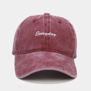 Detail view of Everyday white embroidery on vintage washed red cotton baseball cap
