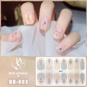 Detail of 5D pink gel nail stickers with blue gems and gold foil accents BB-003