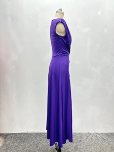 Detail of dark purple off-shoulder dress with pleated waist and elegant flowing skirt